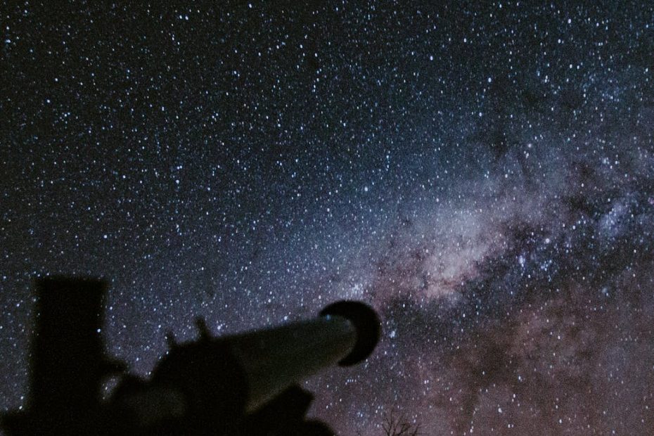 telescope pointing at milky way galaxy at night